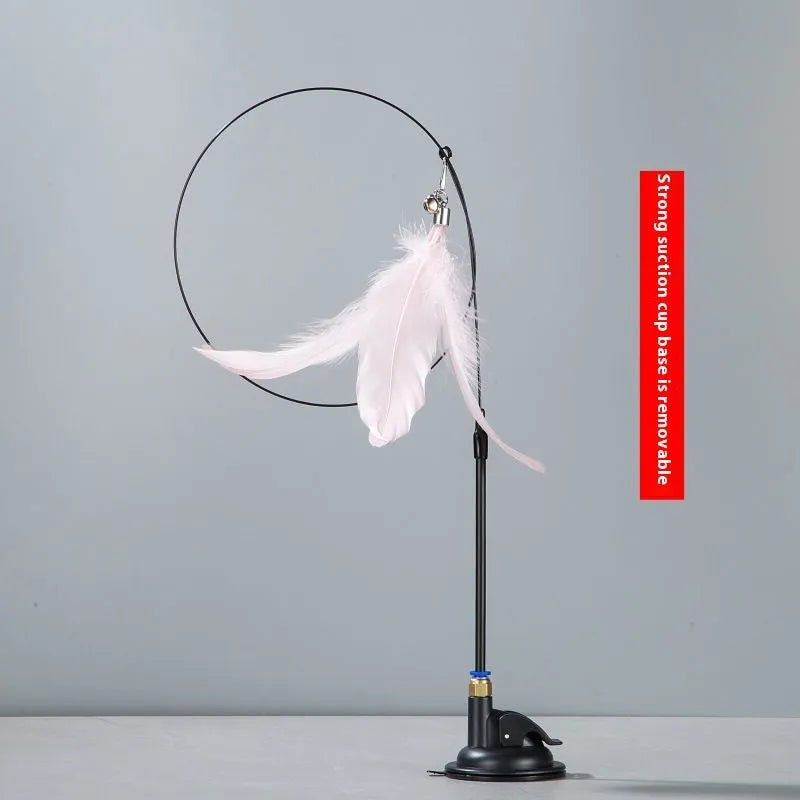 Plastic cat teaser toy with suction cup mount and dangling feather attachment