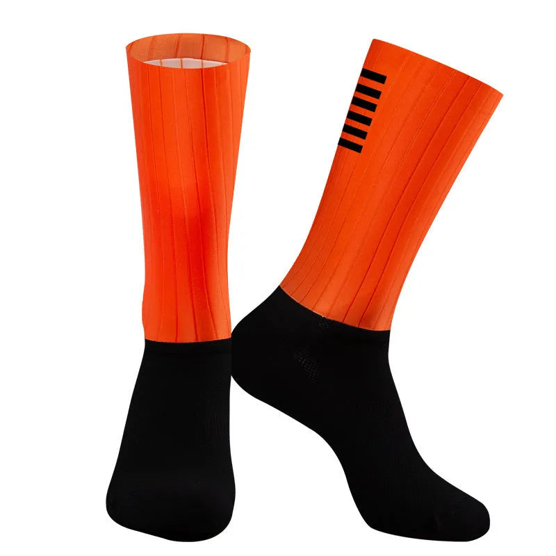 Pair of breathable athletic sports socks for cycling and running in a chemical fibre blend fabric.