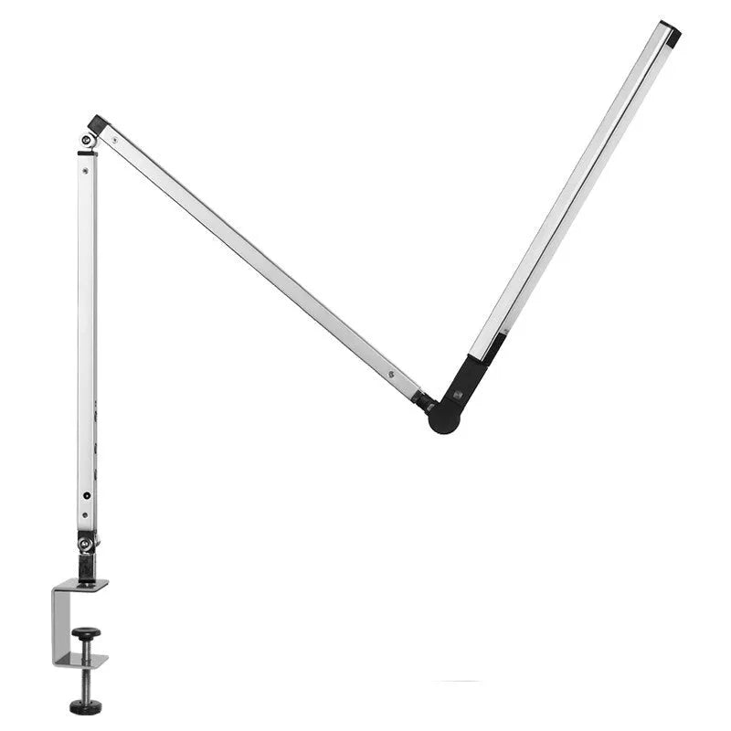 Aluminum clip-on LED desk lamp with dimmer switch mounted on a desk edge.