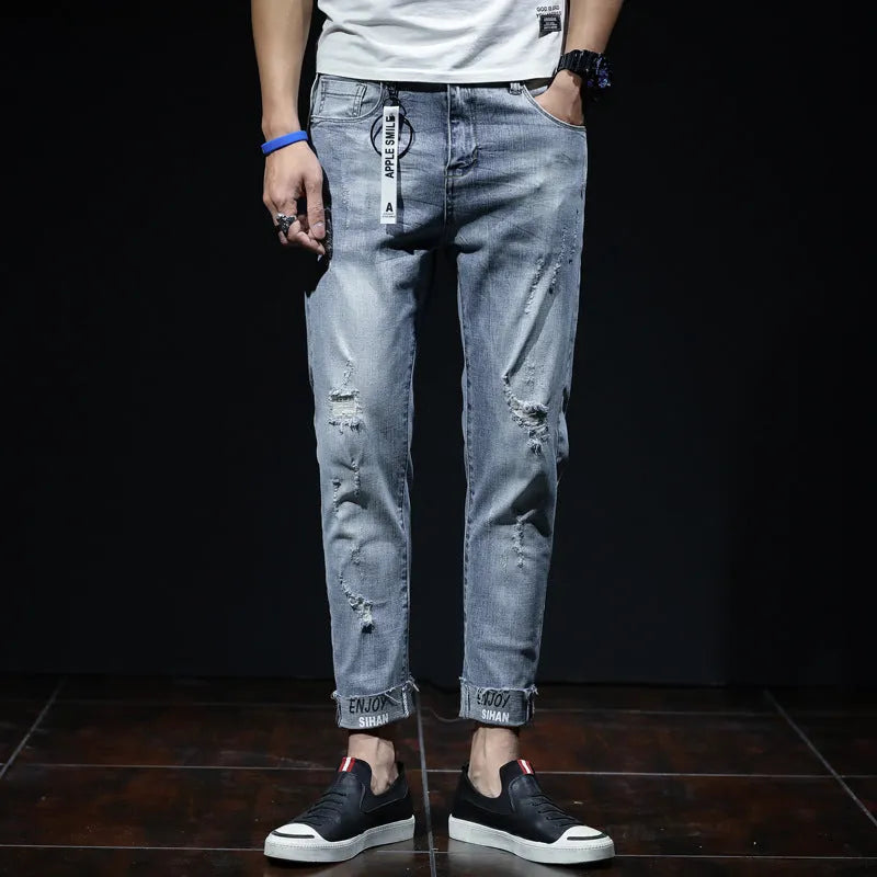 Light blue youth ripped stretch denim cropped skinny jeans mid-waist zip fly