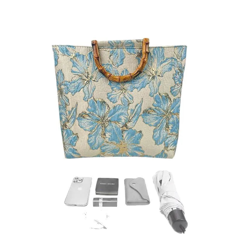 Light blue women's canvas shoulder bag with bronzing flower decorations measuring 30x30x10cm