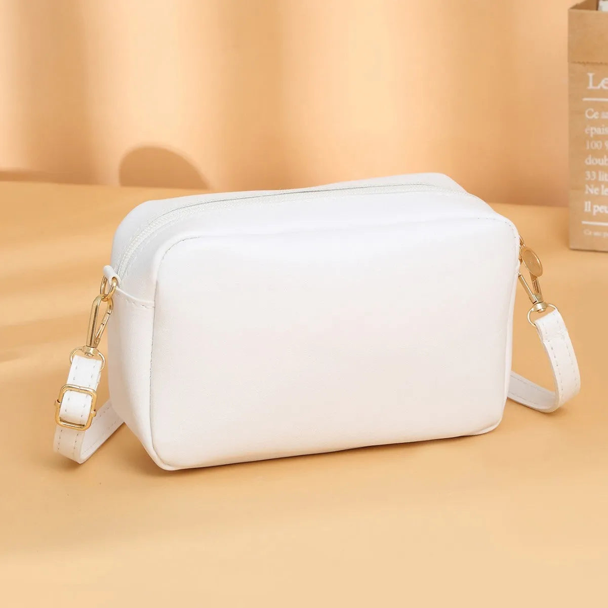 Solid colour PU ladies' shoulder bag in urban simplicity style with three-dimensional pocket.