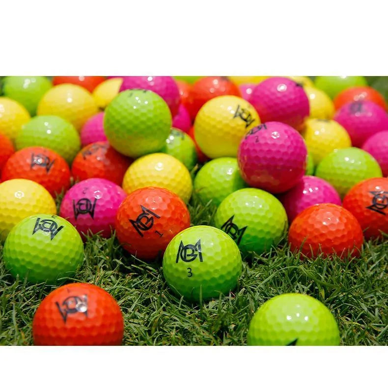 Golf Color Game two-layer practice ball in orange, yellow, green, and rose colours