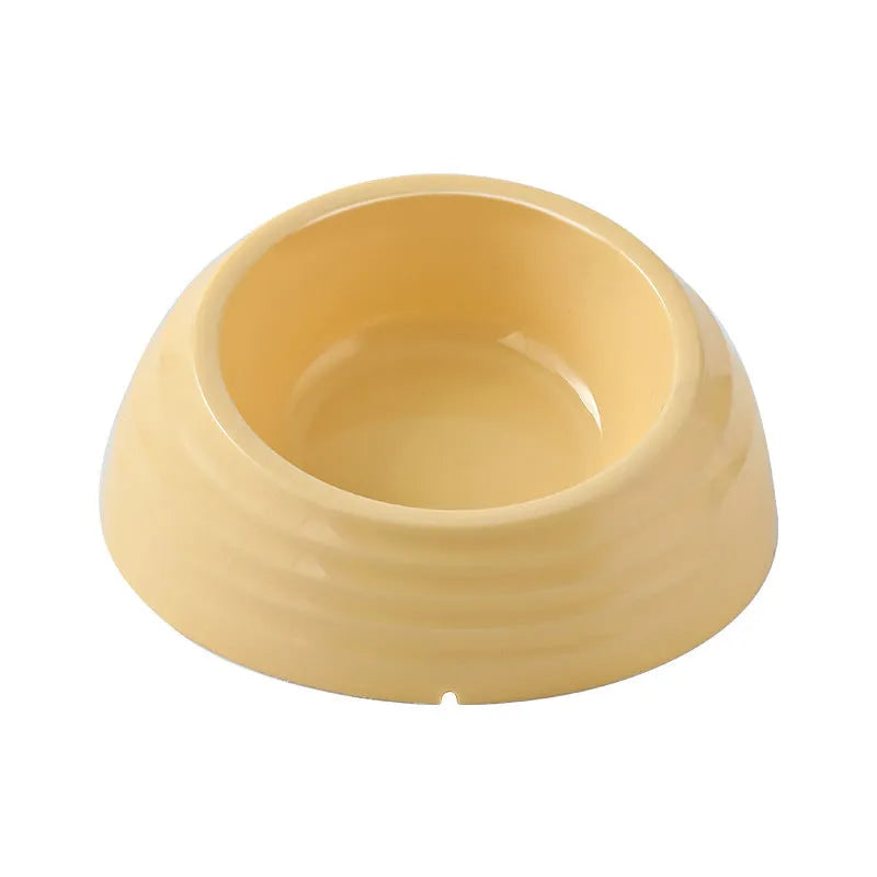 A single stainless steel cat bowl made of plastic, shown in beige, brown, and light green.