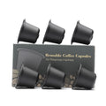 Six recyclable coffee shell filter cups in black, brown, and red plastic with a spoon
