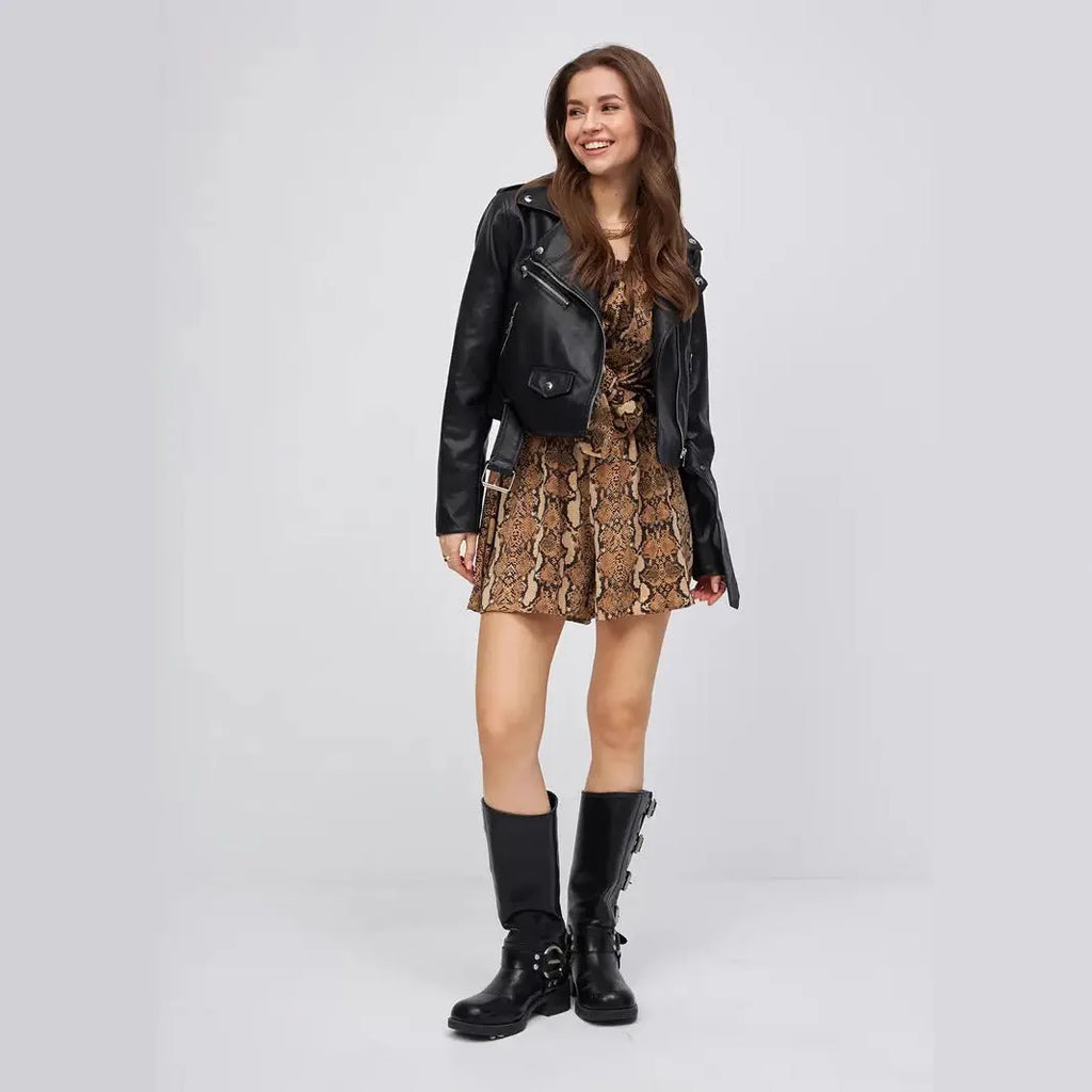 Black women's retro-style imitation leather jacket with a street fashion locomotive design on a model.