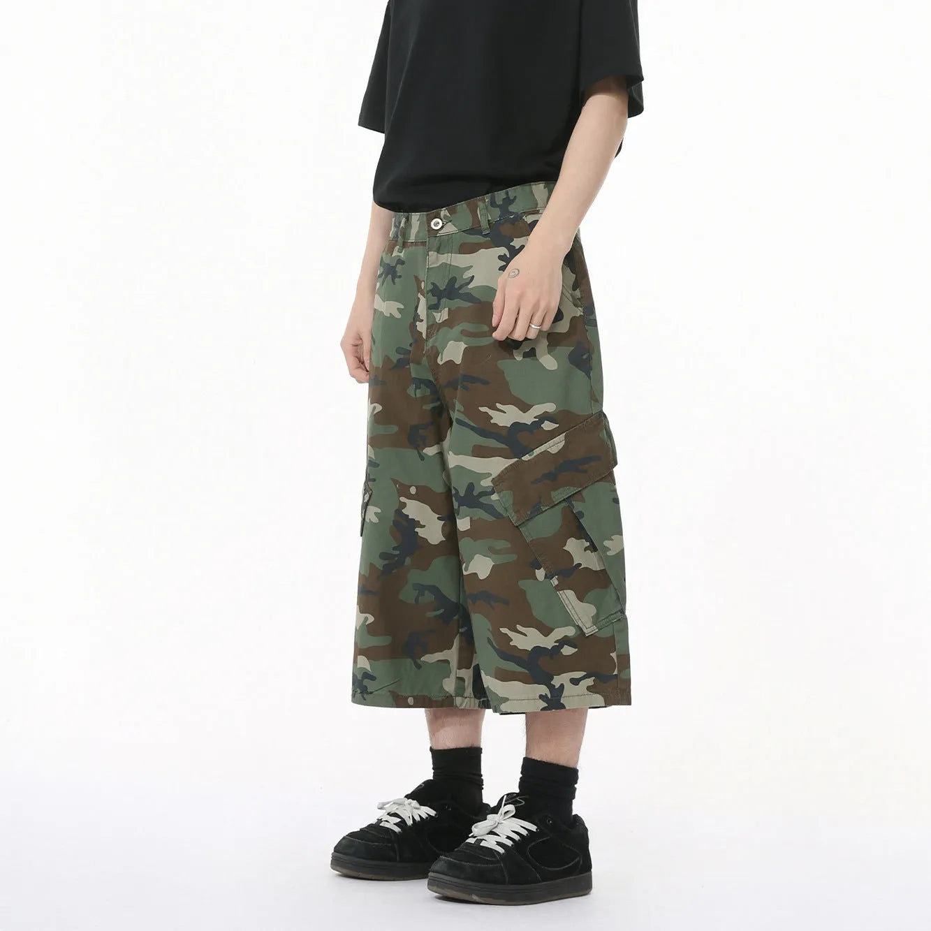 Men's camouflage pattern cotton trousers with wide leg design and cropped length showing side stitching detail