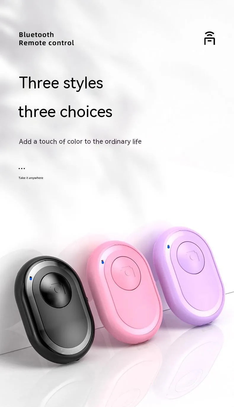 Small black wireless Bluetooth remote control for smartphone photography
