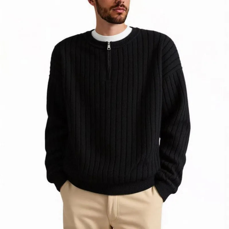 A grey men's half-zip texture knit sweater with a loose fit and long sleeves on a hanger.
