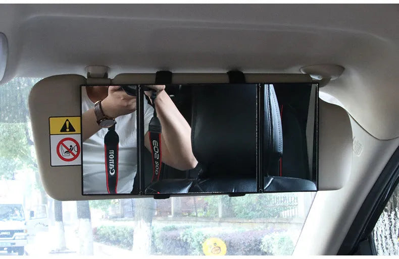 Silver car folding makeup mirror shown closed at 15.5cm and opened to 30.5cm wide.