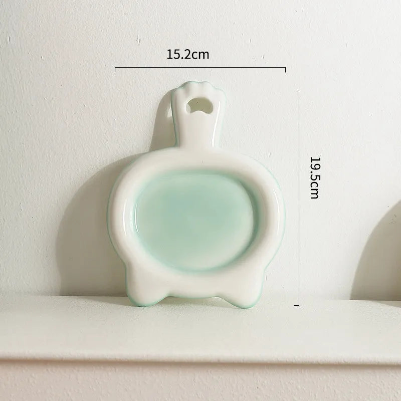 Ceramic cat bowl with shallow design in selected colour showing curved edges for spillage reduction