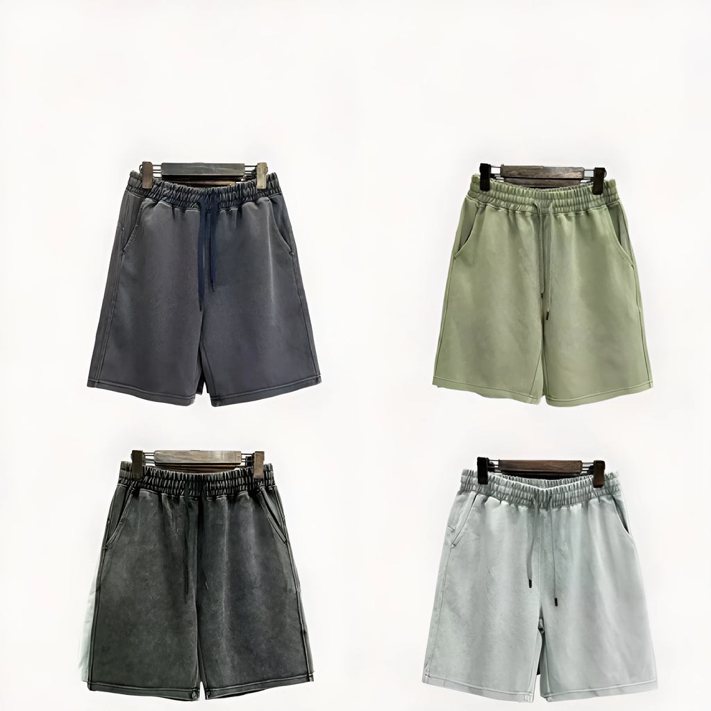 Men's cotton casual shorts in a loose straight-leg fit with distressed detailing, shown in a solid colour.