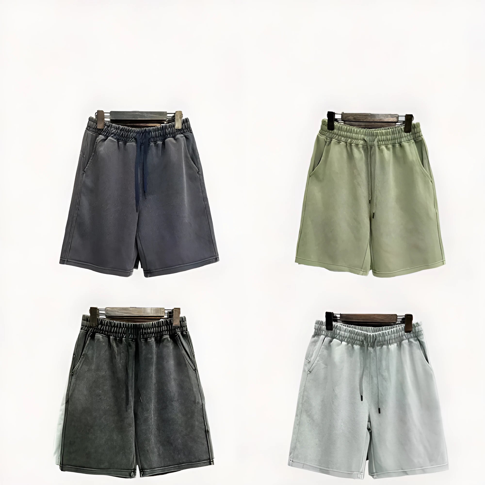 Men's cotton casual shorts in a loose straight-leg fit with distressed detailing, shown in a solid colour.