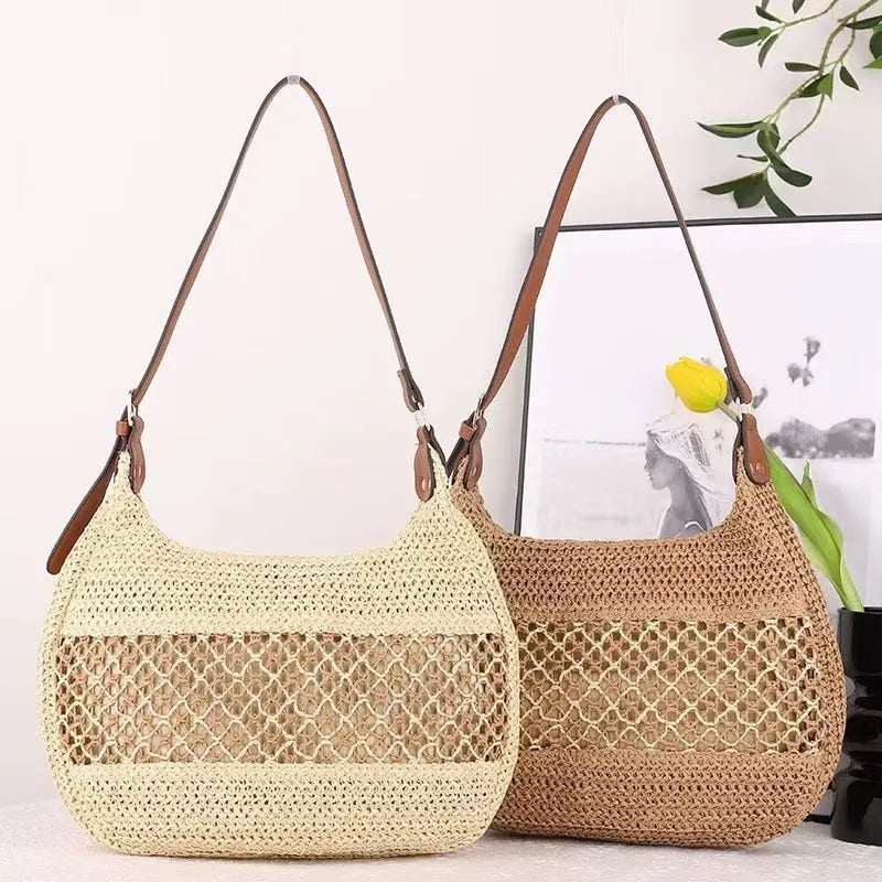 Khaki coloured straw cross body bag with a square shape and an external sandwich pocket.