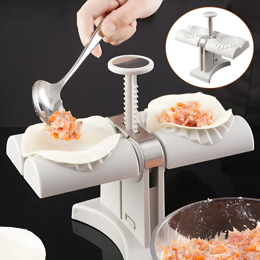 White double head manual dumpling press mould with anti-slip rubber base on kitchen counter.