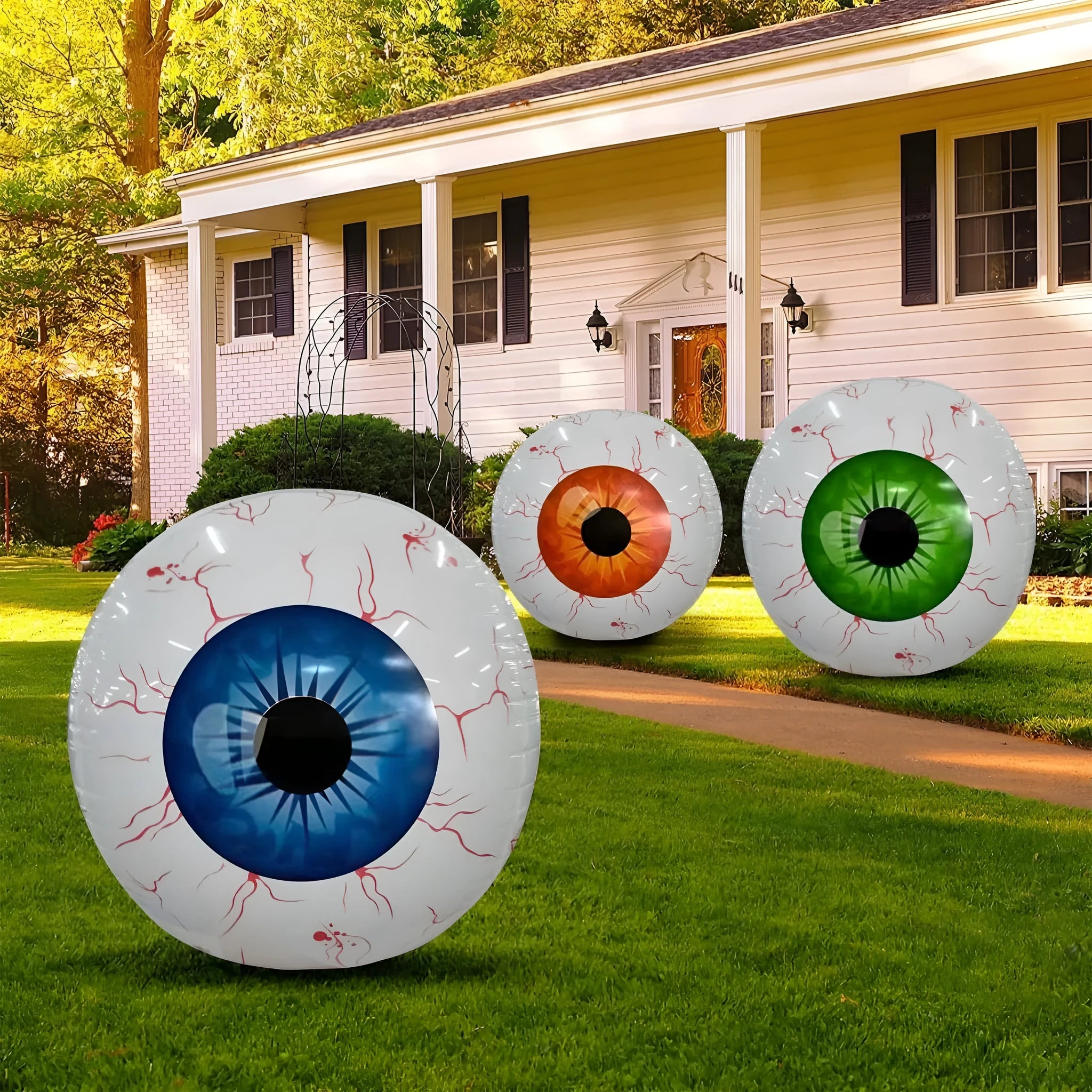 Large green Halloween eyeball balloon with bloodshot design, shown inflated.