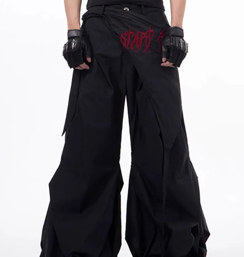 Boy wearing black wide-leg Korean style summer trousers with an elasticated waistband.