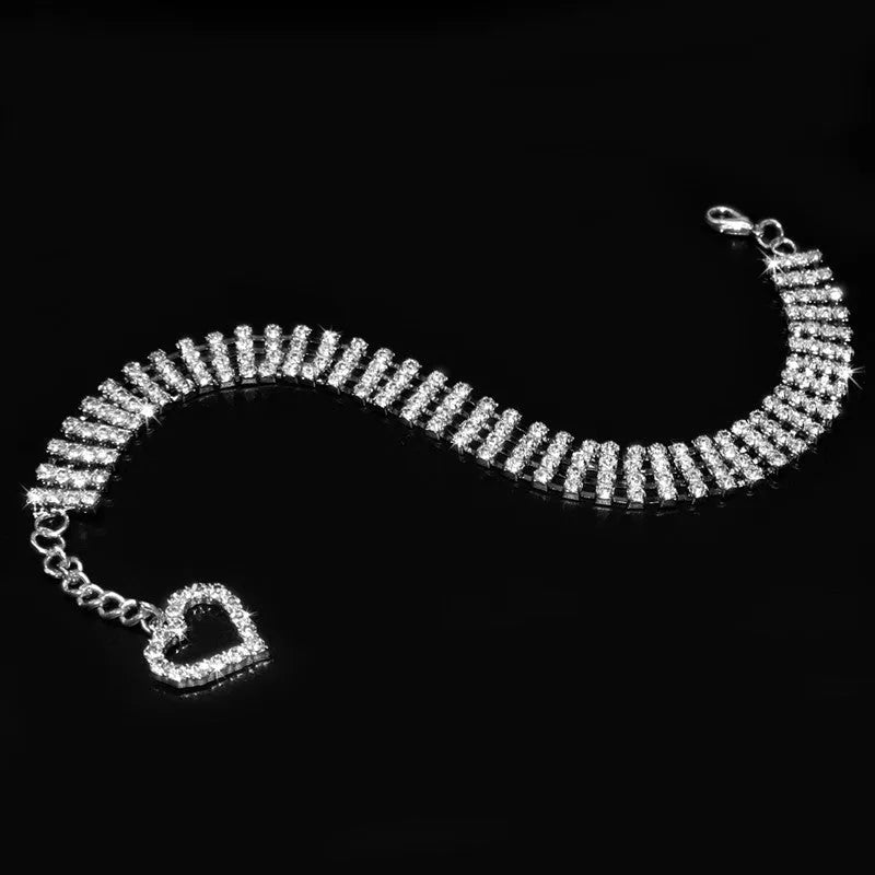 Four-row rhinestone pet collar with heart-shaped chain, silver plated, shown in white, pink, or blue