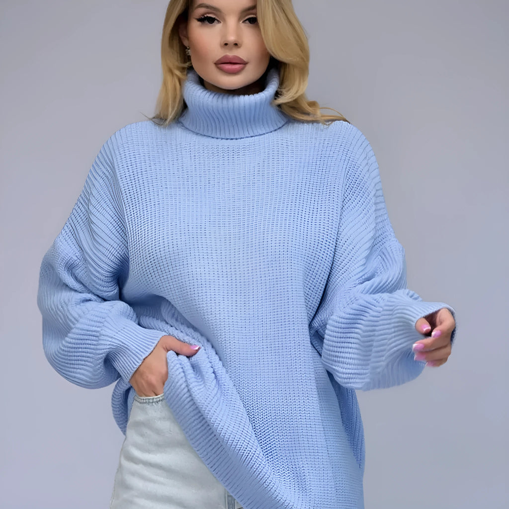 Women's loose-fit high neck pullover sweater in solid colour on hanger.