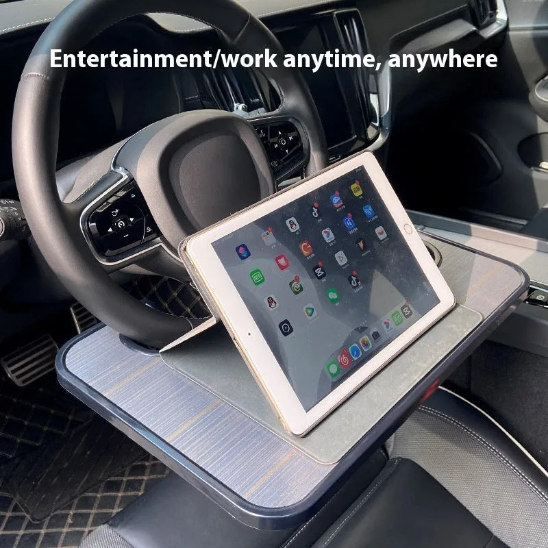 Black ABS car tray with foldable drink cup holder on a car passenger seat
