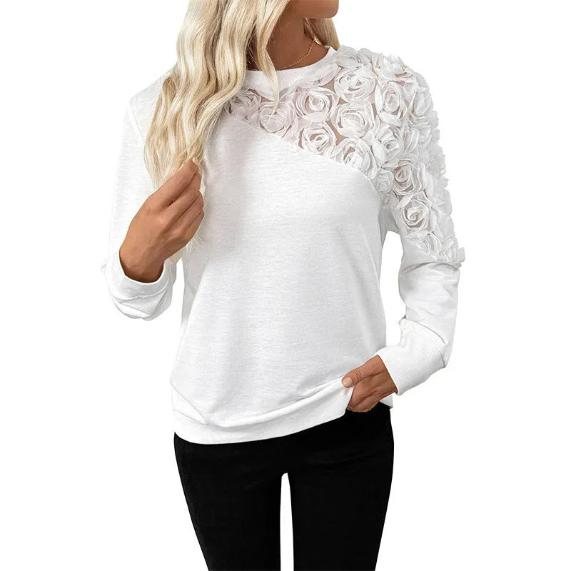 White long sleeve women's top with floral pattern and loose fit design