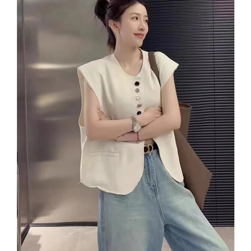 Women's loose fit polyester sleeveless vest in milky white with a visible pocket detail.