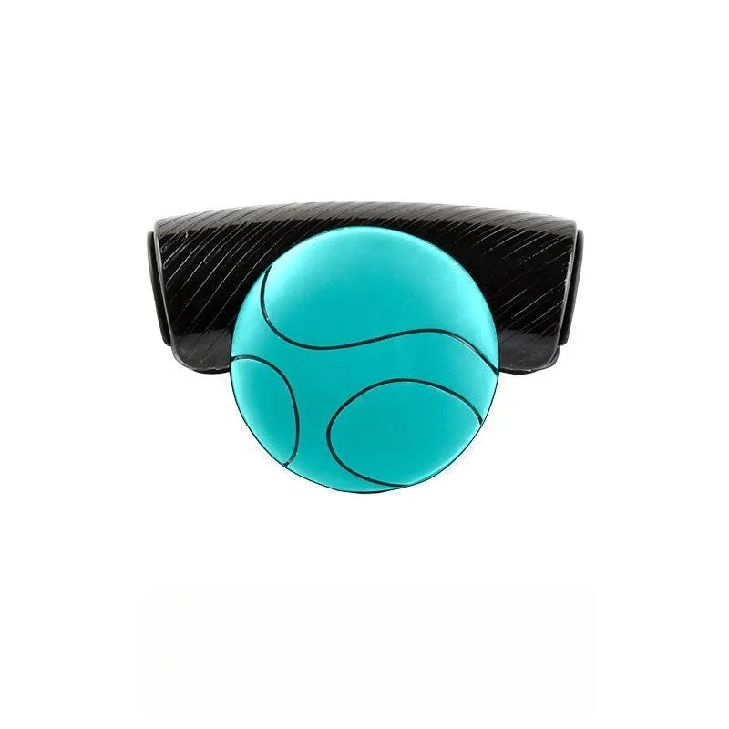 Black silicone steering wheel assistance ball with metal bearing booster installed on car steering wheel