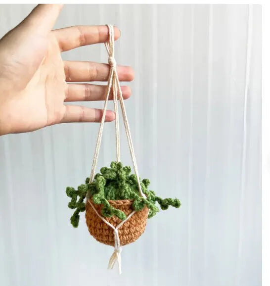 Green and white knitted wool plant ornament for car dashboard with hanging cord