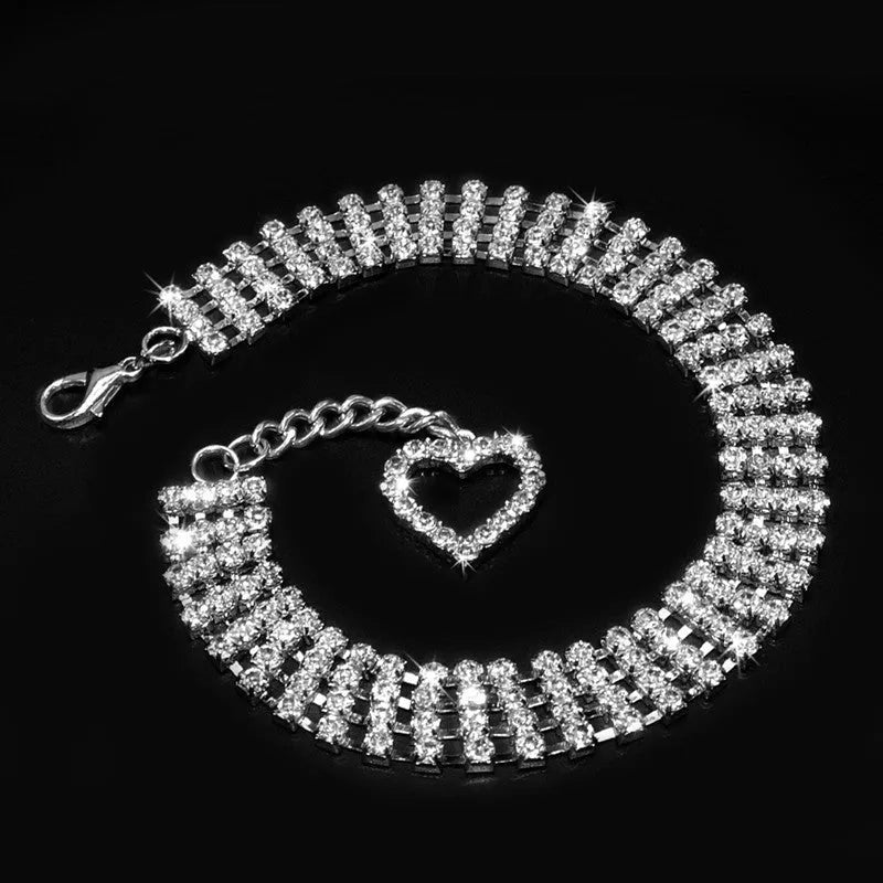 Four-row rhinestone pet collar with heart-shaped chain, silver plated, shown in white, pink, or blue