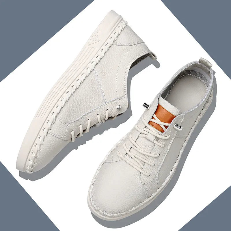 Men's beige casual leather sneakers with mesh lining and round toe stitching detail.