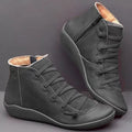 Women's flat casual booties in a round-toe design with a wedge heel, shown in a choice of colours.