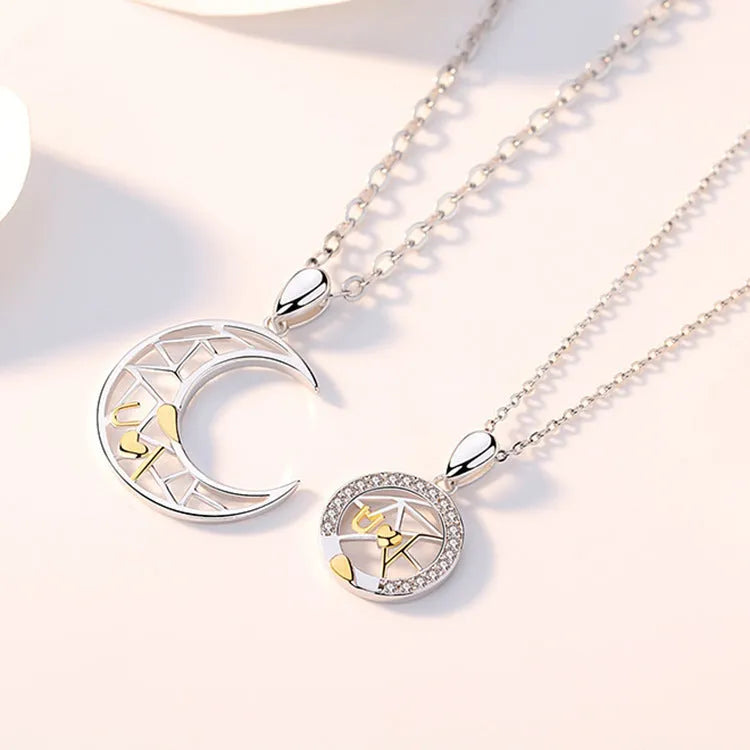 Copper sun and moon couple necklace with electroplated finish and cross chain.