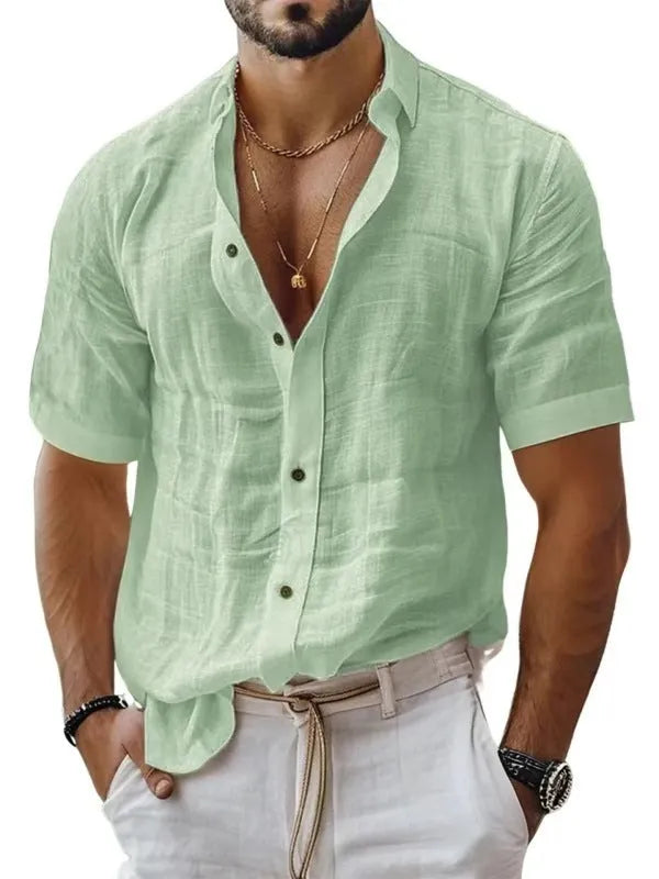 Men's solid colour short sleeve lapel shirt in light green shown on a hanger