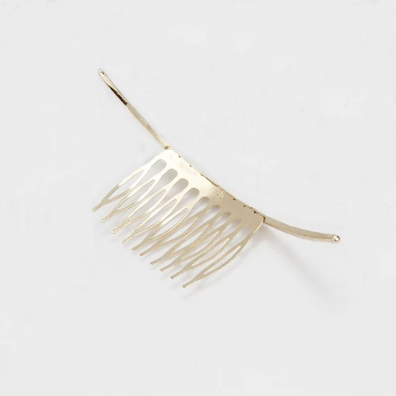Curved alloy hair comb in gold and silver, 11cm long and 4cm wide, lightweight styling tool