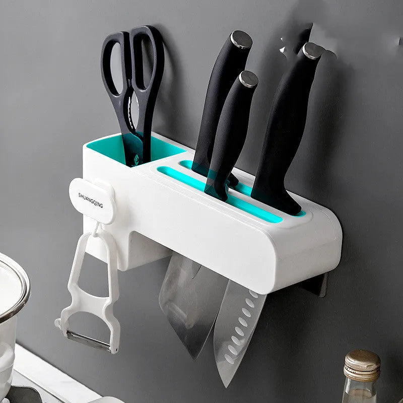 White plastic freestanding kitchen knife rack on a countertop.