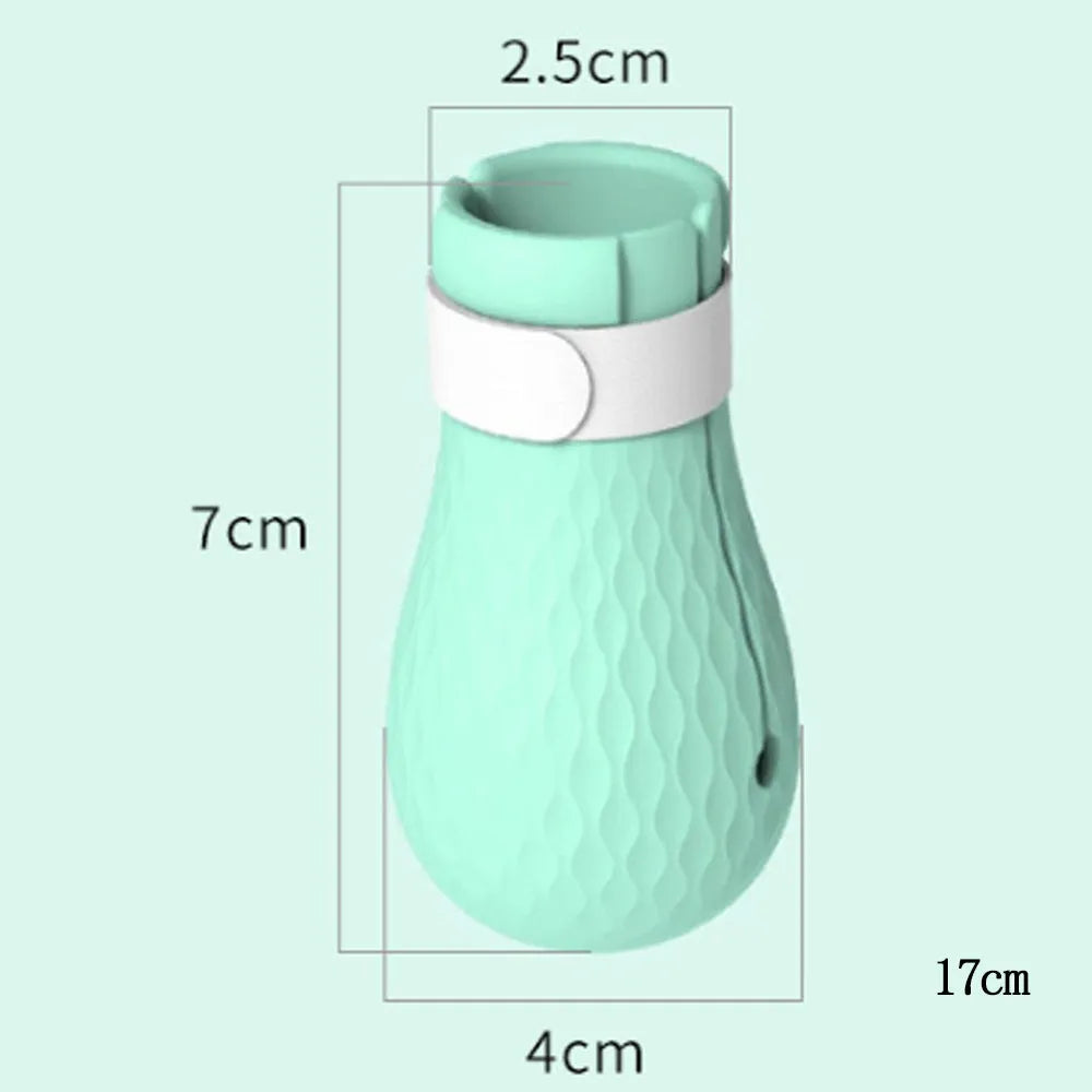 Four green silicone cat anti-scratch foot cover gloves for paw protection during grooming