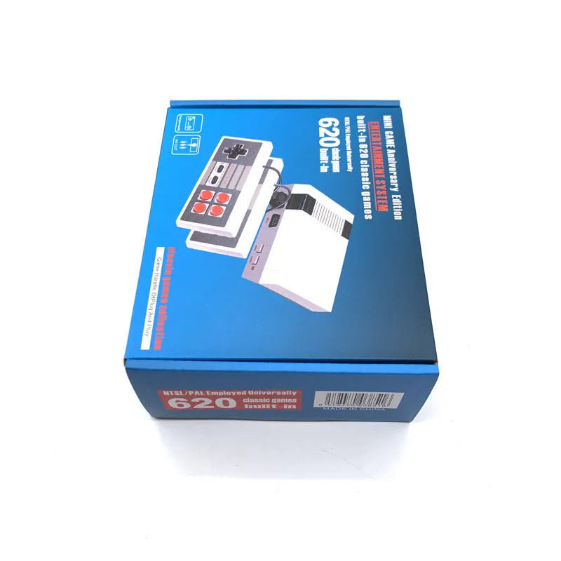 Compact red and grey retro NES game console with two wired controllers on a wooden table.