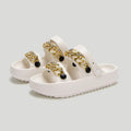 Women's thick-soled EVA slippers with buckle fastening and round toe, in black or beige, for indoor and outdoor wear.