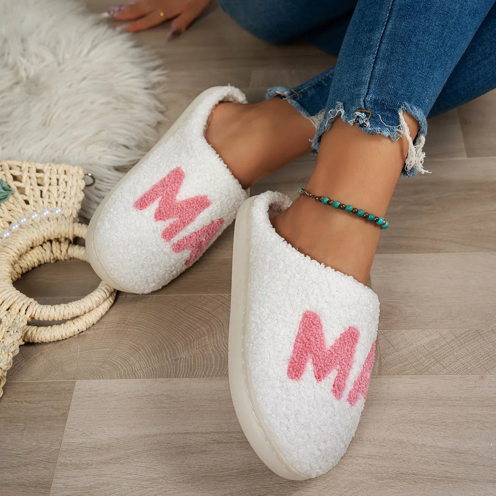 White plush cotton slippers with non-slip TPR sole on indoor floor