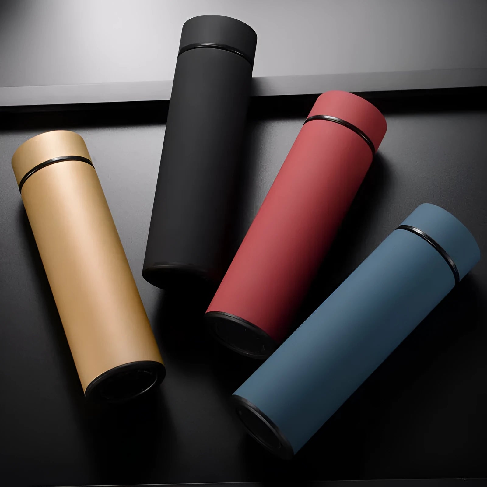 450ml stainless steel vacuum insulated water bottle in choice of colours including black, red, gold, and blue.