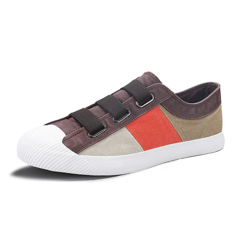 Men's low-top canvas sneaker with elastic band, round toe, and vulcanised rubber sole in beige colour.