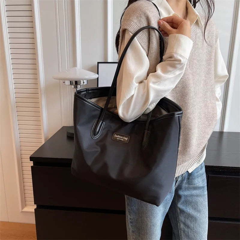 Large capacity women's shoulder bag in black oxford cloth with double straps and hidden pocket, vertical square shape