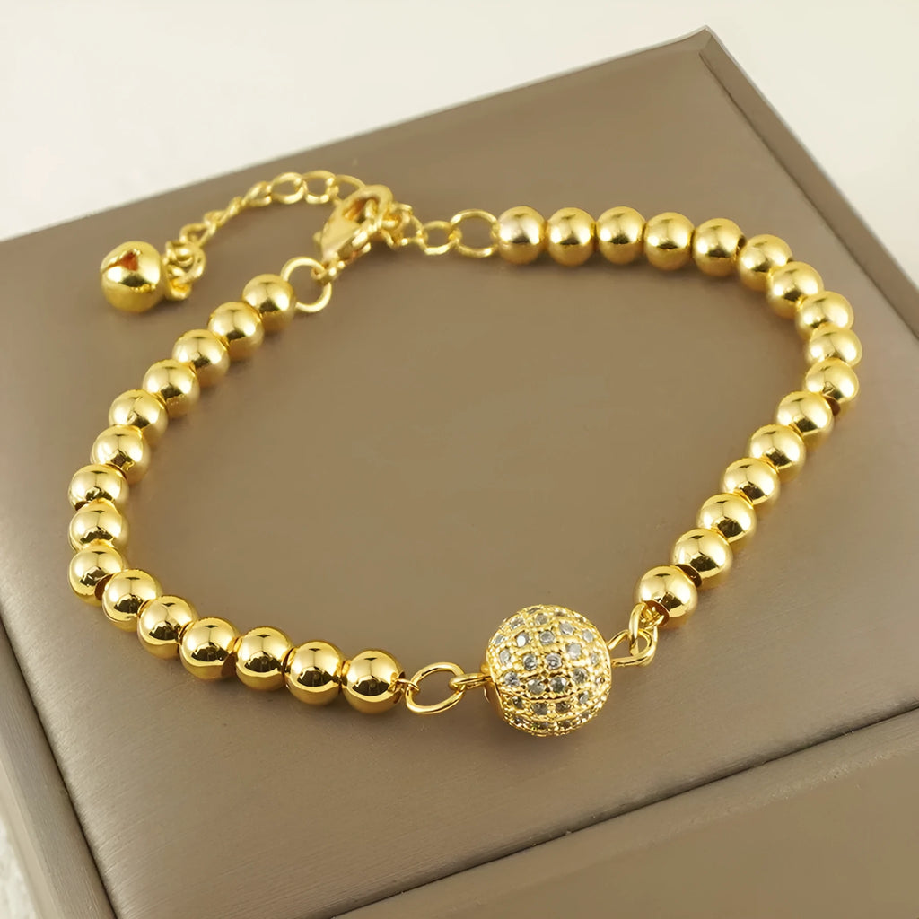 Heart-shaped copper bracelet with round zircon stones in an Arabic style.