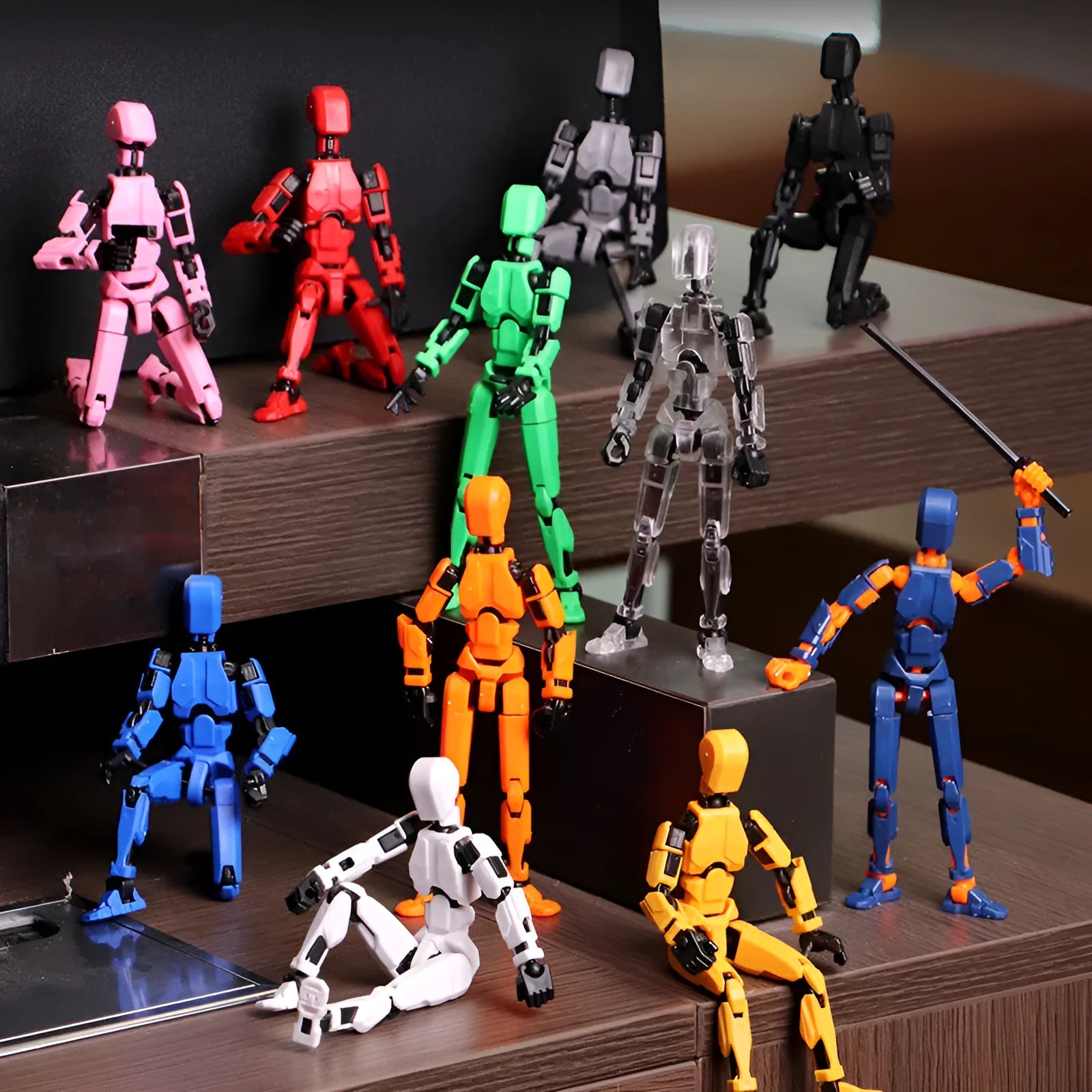 Multi-jointed 3D printed robot action model with movable limbs on a desk.