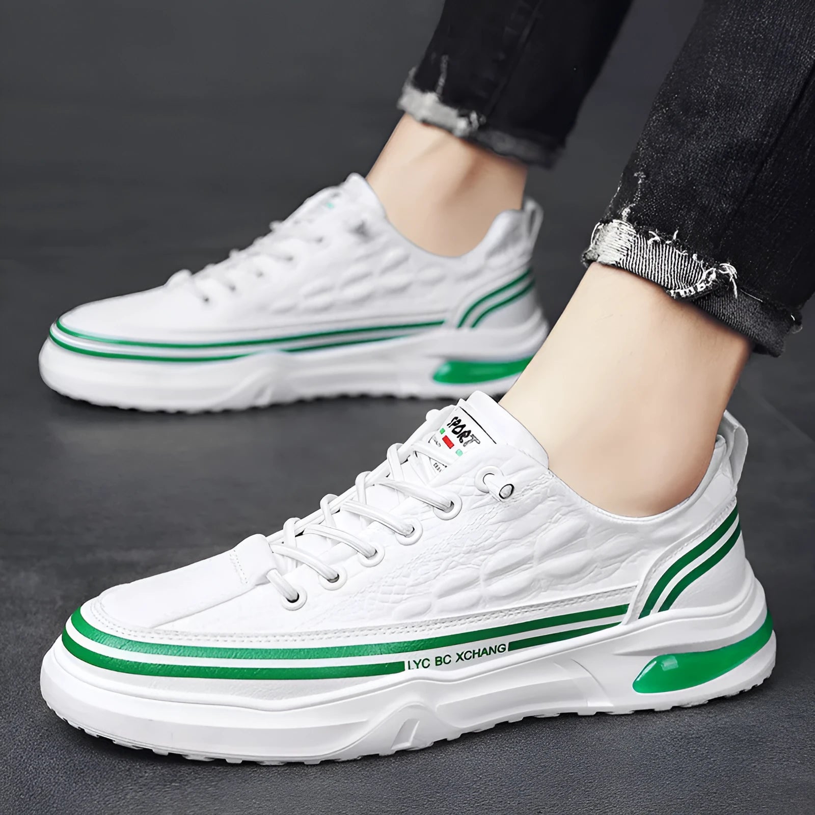Youth low-top slip-on canvas sneakers in white black, side view