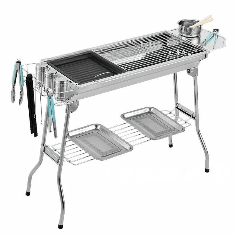 Stainless steel portable folding barbecue oven with large grill area.