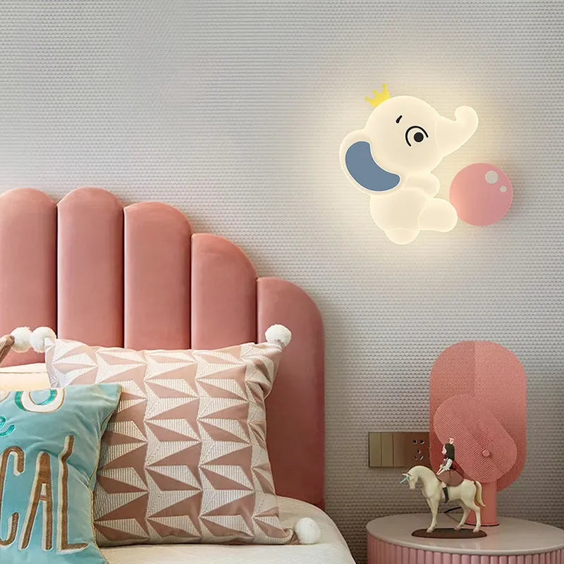 White cartoon elephant wall light with tricolour dimming, 22cm balloon elephant design, on a wall in a child's room