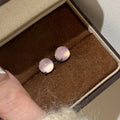 Chinese style geometric chalcedony stud earrings in four claw setting with round egg surface stones