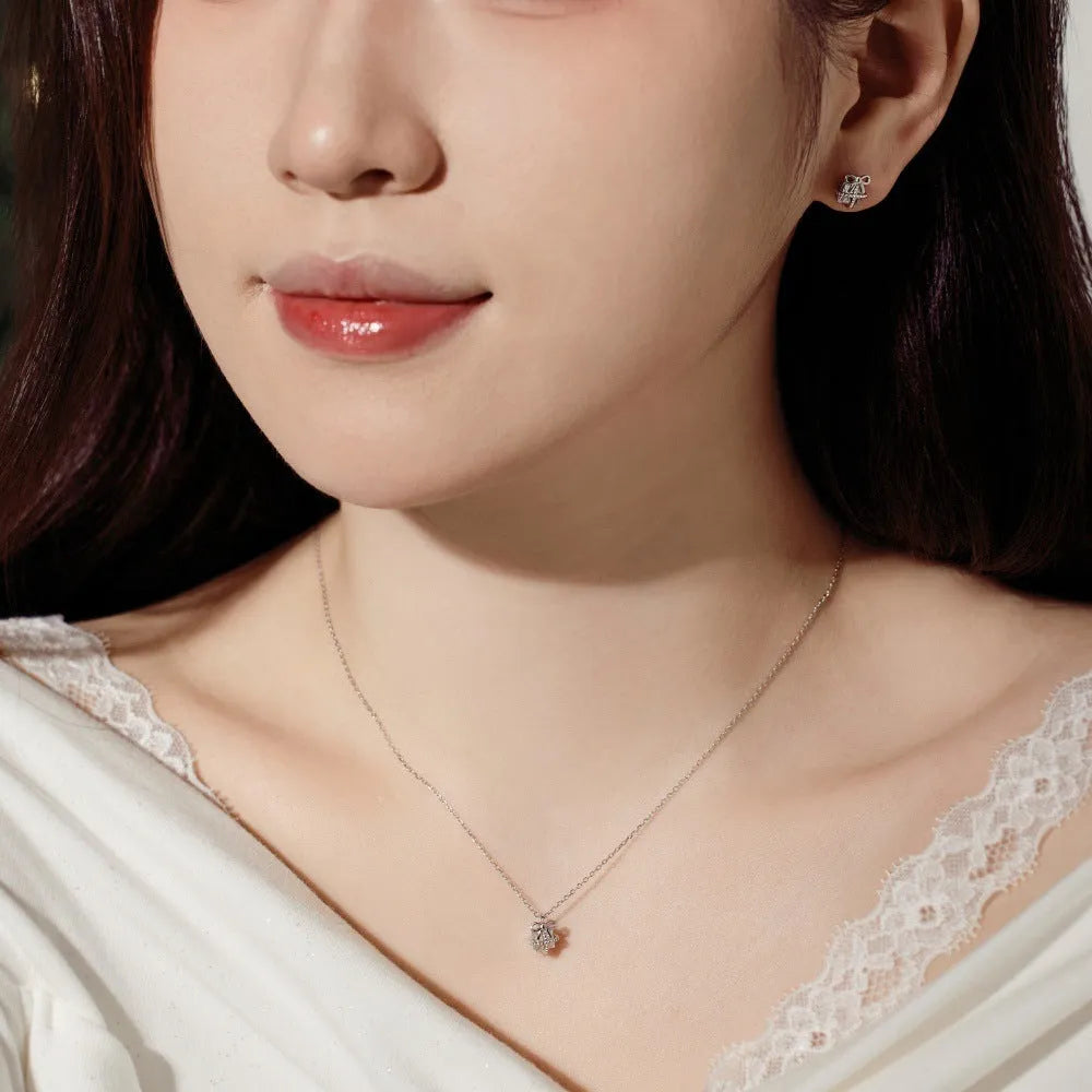 S925 sterling silver necklace and earring set with bear pendant in gold finish on display