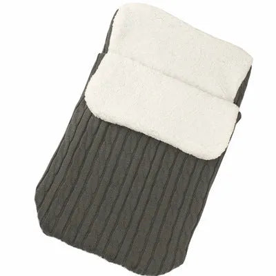 Envelope-style baby stroller sleeping bag in a plain colour, shown on a pram with lamb cashmere lining visible.